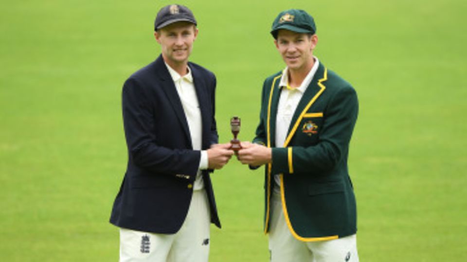 Joe Root and Tim Paine pose with the Ashes urn