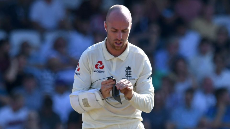 Jack Leach wipes the sweat from his glasses during his innings of one not out