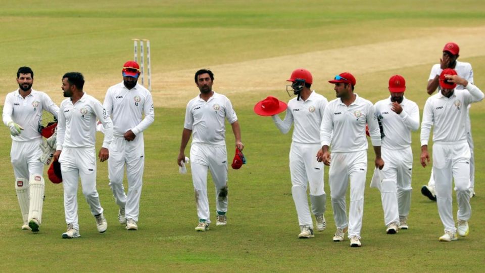 The Afghanistan players walk off the field