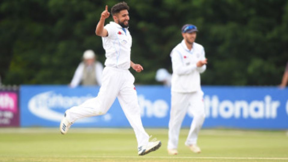 Anuj Dal of Derbyshire celebrates as he gets Australia's Usman Khawaja out during a Tour match