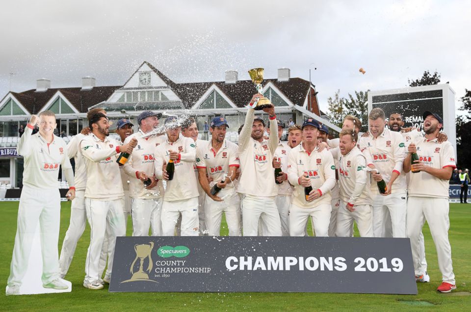 Ryan ten Doeschate lifts the County Championship trophy as his Essex team-mates celebrate