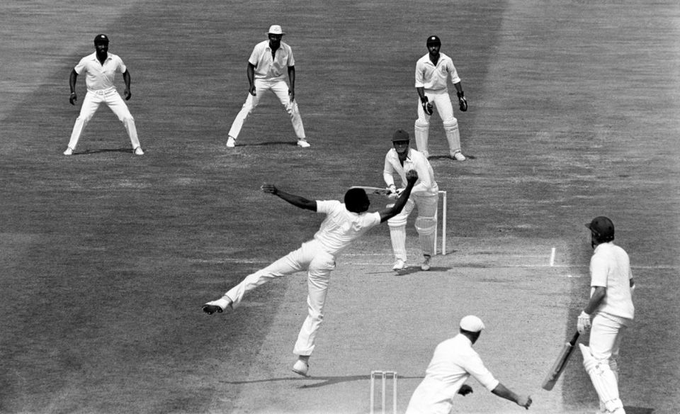 The best of the best: Michael Holding takes a catch off his own bowling, watched by Jeff Dujon behind the wicket and Viv Richards at second slip