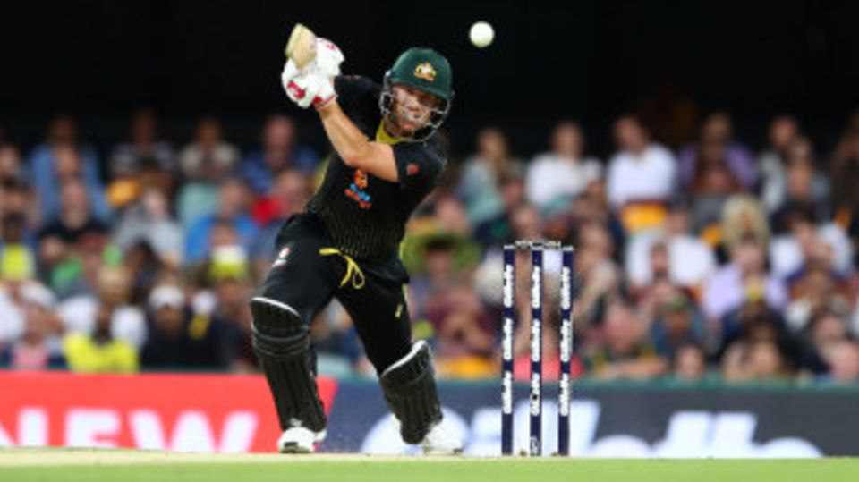 David Warner drives through the off side