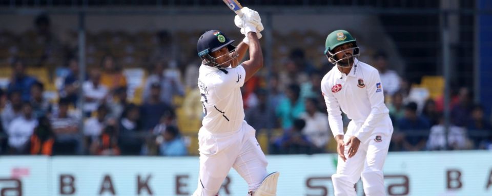 Mayank Agarwal lifts the ball for a six