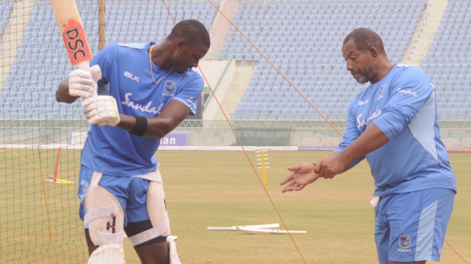 Jason Holder discusses his batting with coach Phil Simmons
