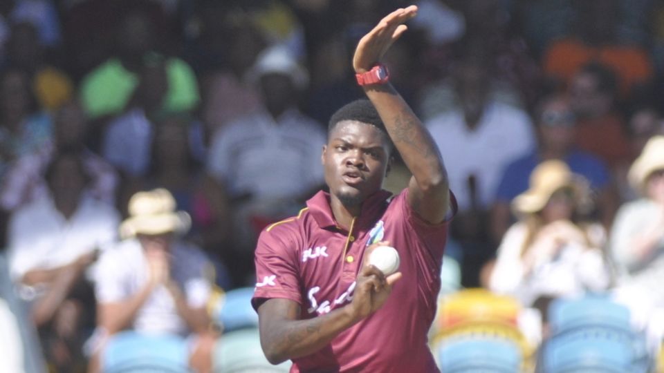Alzarri Joseph jumps in his delivery stride