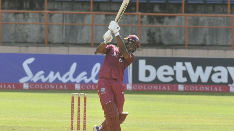 Evin Lewis hits down the ground during his hundred