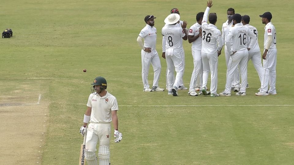 Sri Lanka's players get together to celebrate the dismissal of Craig Ervine