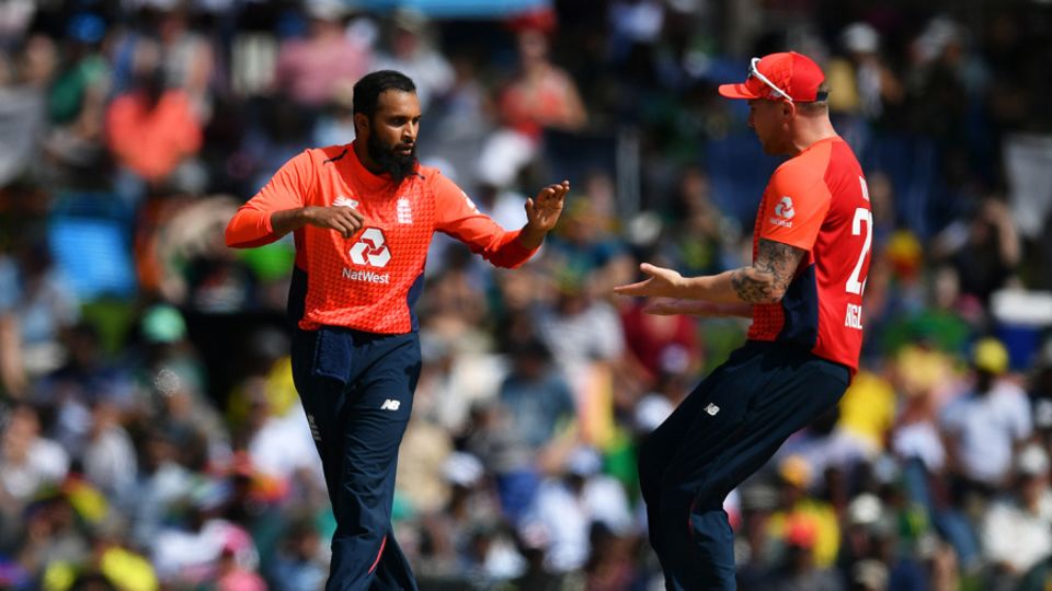 Adil Rashid celebrates with Jason Roy