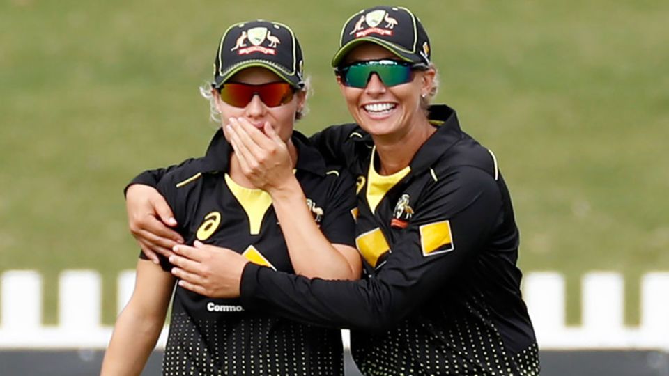 Nicola Carey (left) is congratulated on her catch to remove Smriti Mandhana
