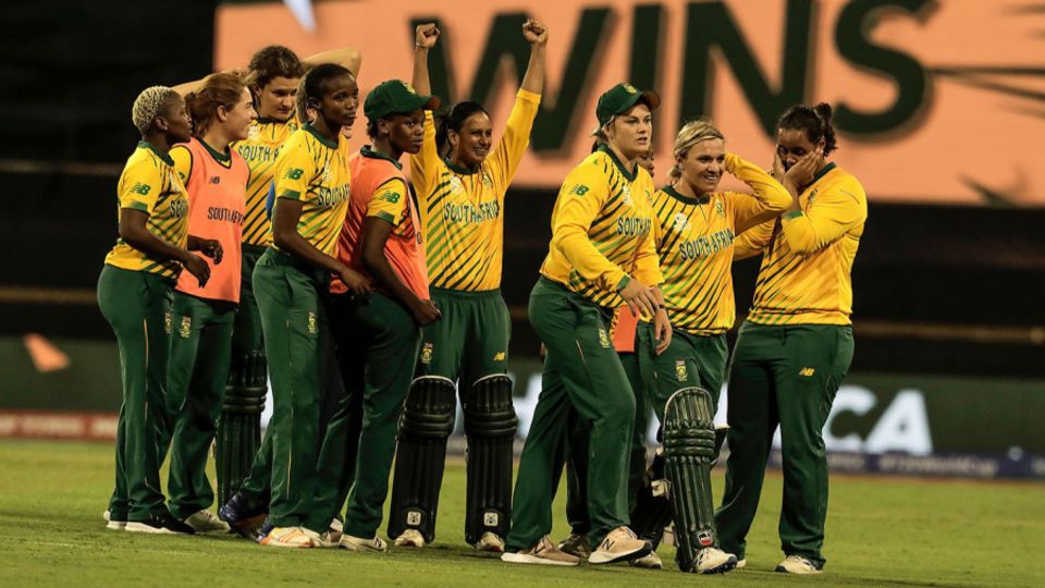 Mignon Du Preez and Dane van Niekerk lead their team in celebration after defeating England
