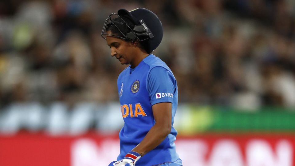 Harmanpreet Kaur wears a dejected look while walking back