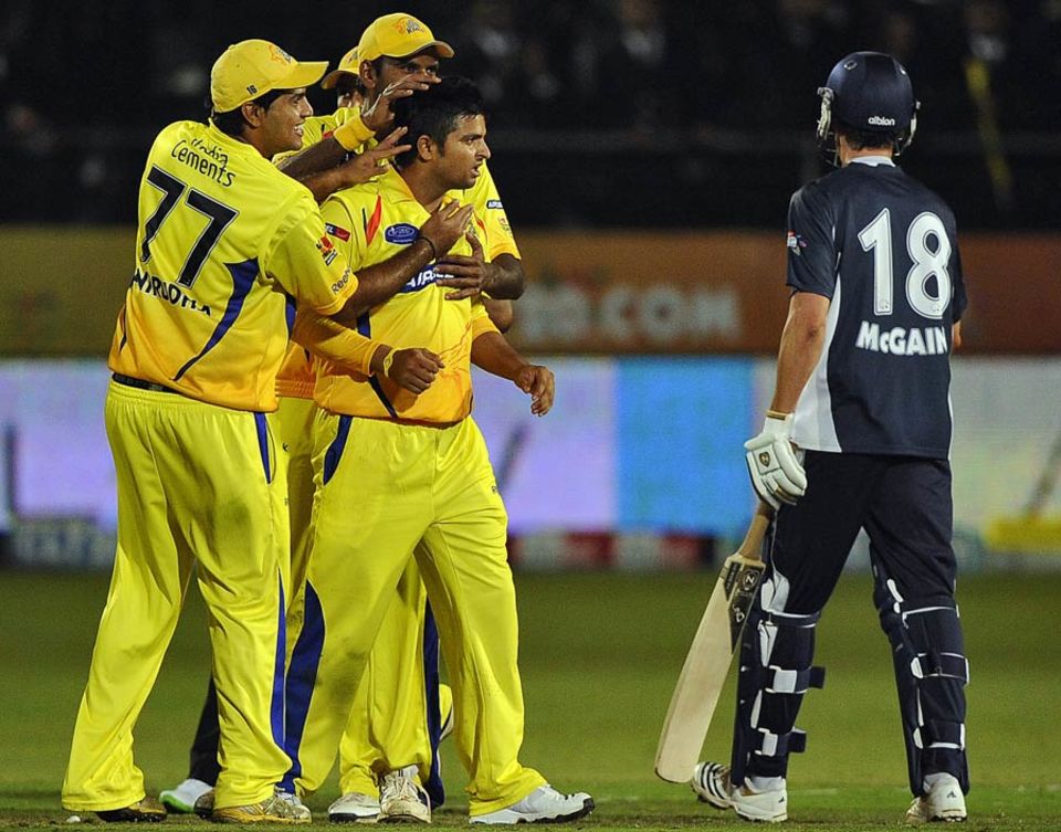 Yellow Magic Orchestra: his team-mates get their hands on Suresh Raina, who took four wickets and effected a run-out against Victoria in the 2010 Champions League T20