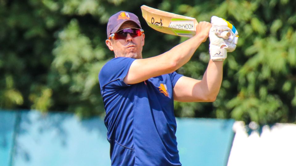 Netherlands coach Ryan Campbell hits a skier during fielding practice