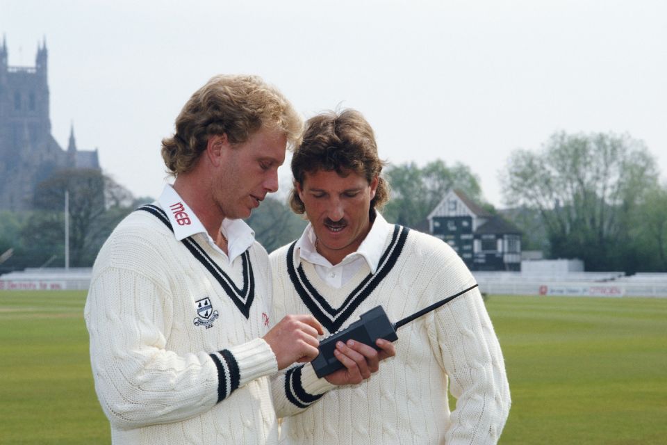 Graham Dilley presumably teaching Botham how to use a mobile phone to terrorise umpires and batsmen