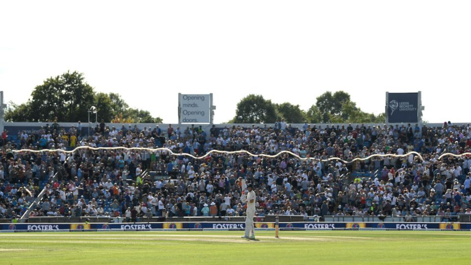 Joe Root waits to bat as a giant beer snake is built in the Western Terrace