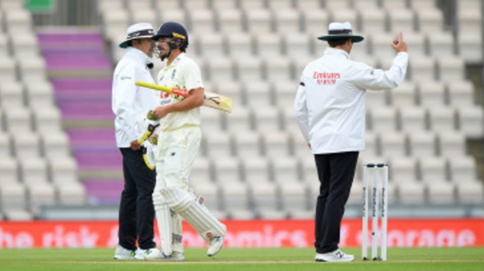 Rory Burns leaves the field after being dismissed by Shannon Gabriel on review