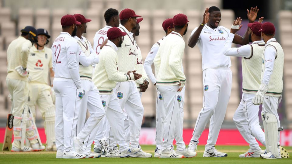 Jason Holder celebrates with team-mates after dismissing Jofra Archer