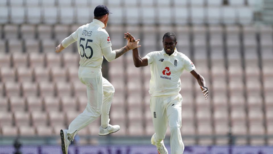 Jofra Archer and Ben Stokes celebrate the dismissal of Roston Chase