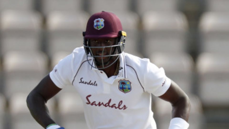 Jason Holder takes a single