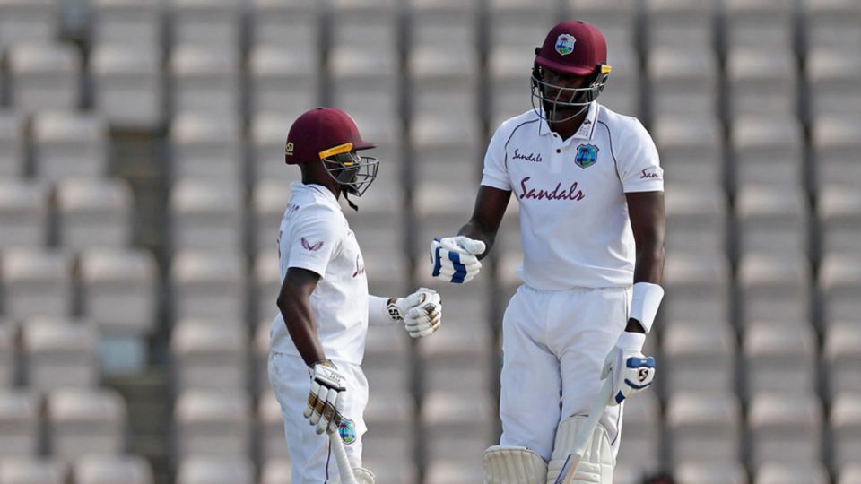 Jermaine Blackwood and Jason Holder chat in the middle