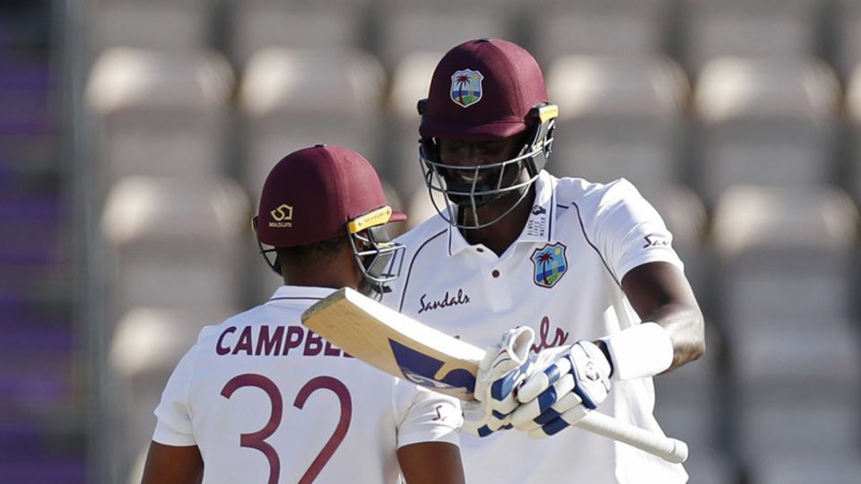 Jason Holder and John Campbell celebrate victory