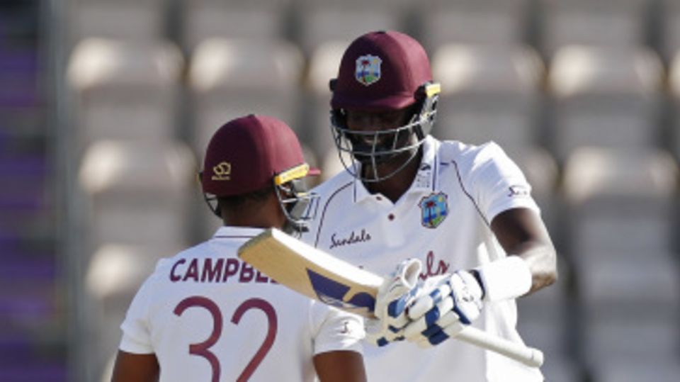 Jason Holder and John Campbell celebrate victory