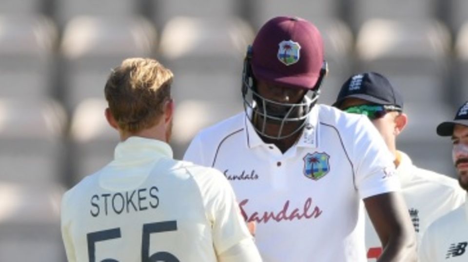 Ben Stokes and Jason Holder shake hands after West Indies won the first Test