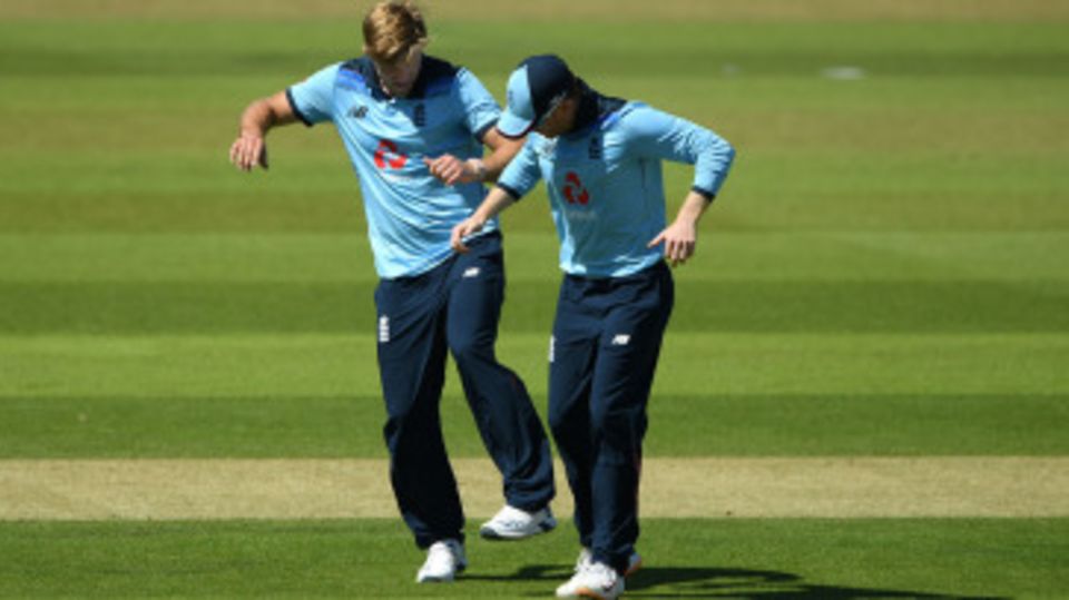 David Willey and Eoin Morgan practise a socially distant celebration