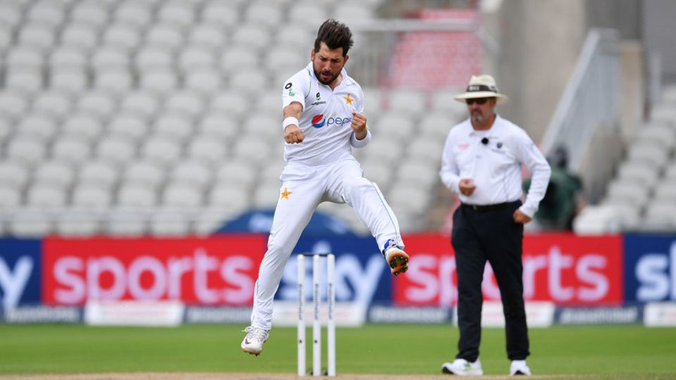Yasir Shah punches the air after bowling Jos Buttler
