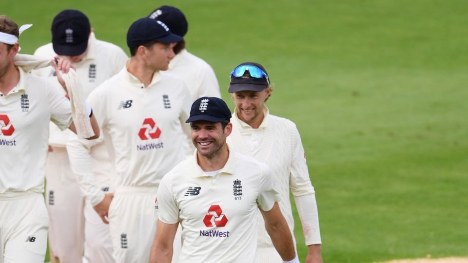 The man of the hour, James Anderson, leads the England team off the field
