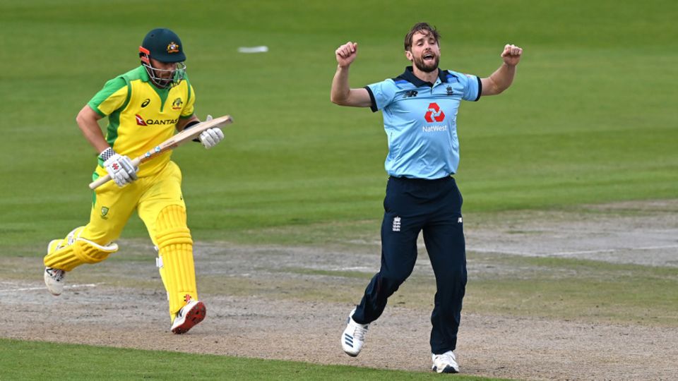 Chris Woakes celebrates taking the wicket of Aaron Finch