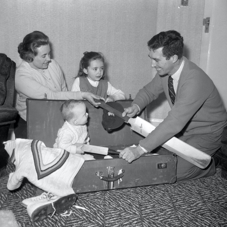 Nine-month-old Mark Titmus packs for an overseas Test tour, with a little help from dad Fred