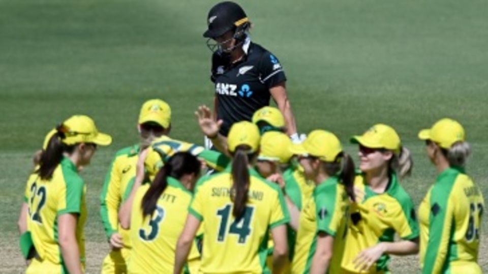 Sophie Devine walks back after her dismissal