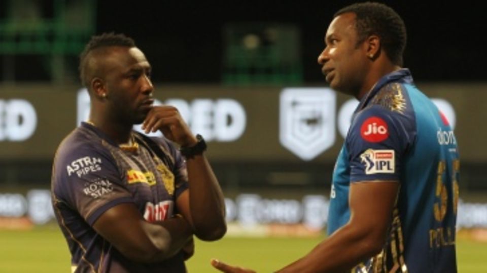 Andre Russell and Kieron Pollard have a chat after the game