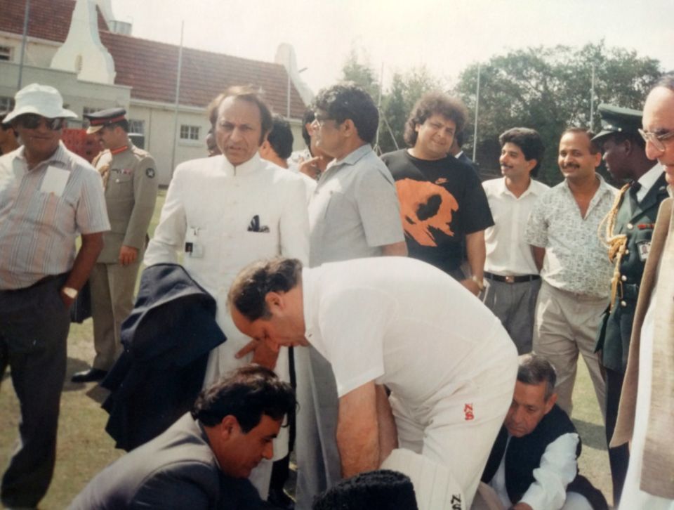 Nawaz Sharif pads up for practice. Behind him (wearing white) is Rafat Mahdi