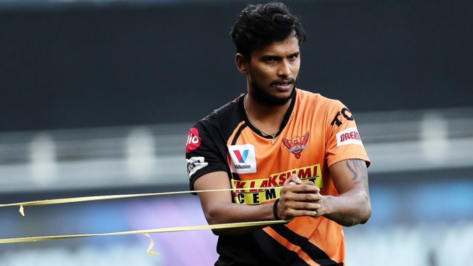 T Natarajan stretches with a resistance band