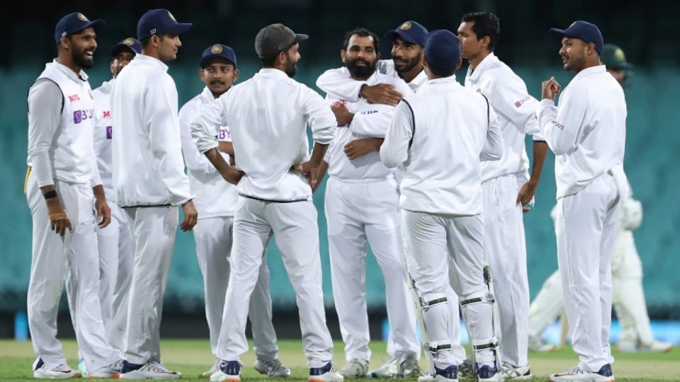 Mohammed Shami celebrates with team-mates after dismissing Marcus Harris