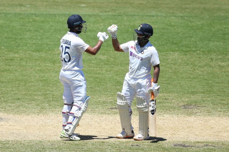 Cheteshwar Pujara and Rishabh Pant bump fists during their partnership