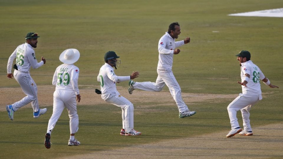 The Pakistan fielders are jubilant after Nauman Ali snares one