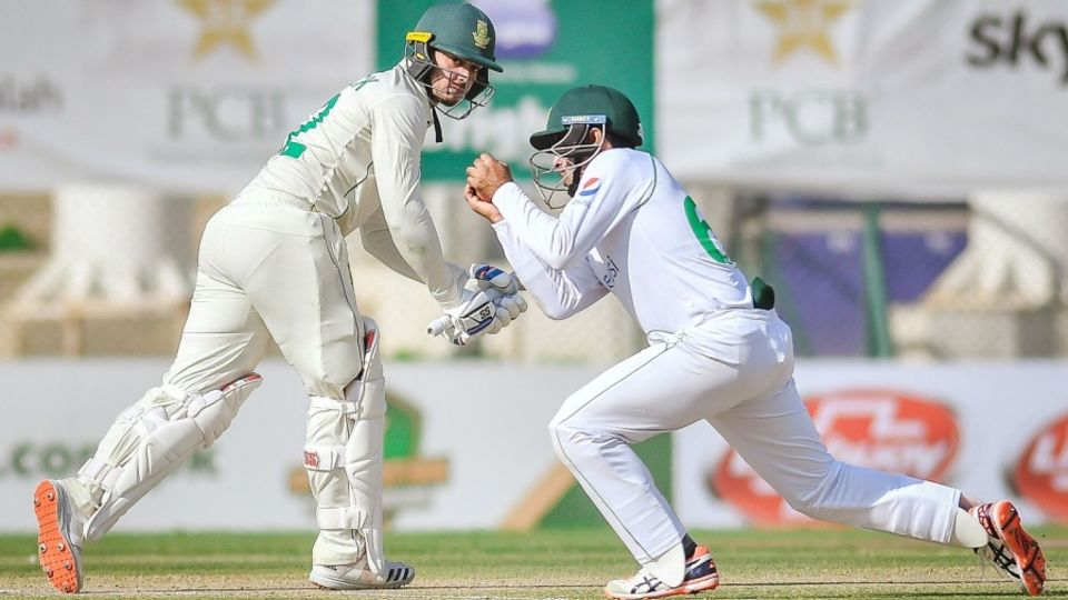 Quinton de Kock is caught by Abid Ali at short leg during the first Test