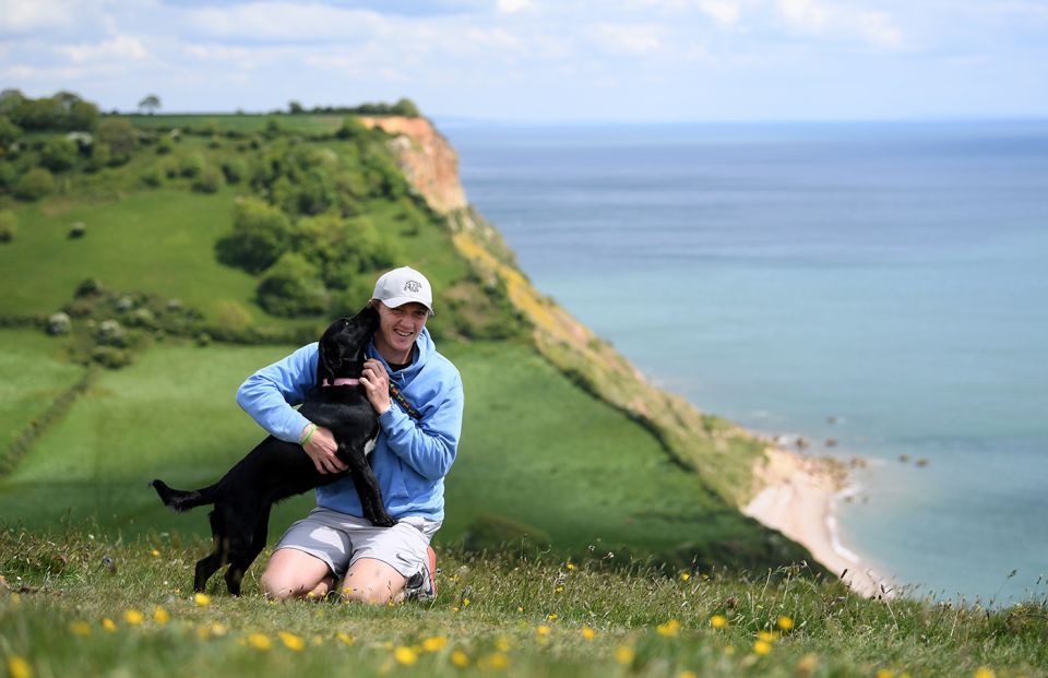 Dom Bess with his parents' dog, Tilly, in Shipton, Yorkshire