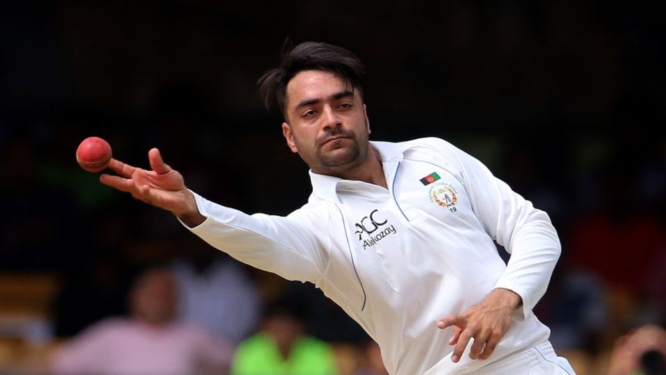 Rashid Khan throws the ball back from the outfield