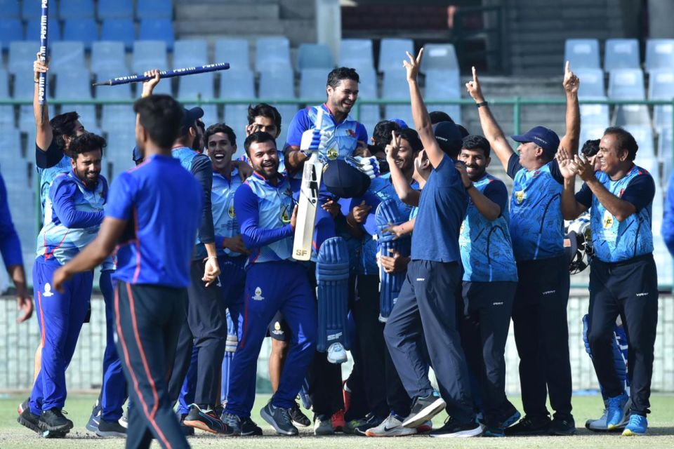 Aditya Tare is chaired off the field by his team-mates after scoring a match-winning century in the final