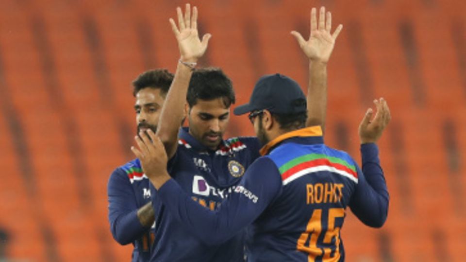 Bhuvneshwar Kumar is congratulated by Rohit Sharma and Suryakumar Yadav on breaking a big partnership