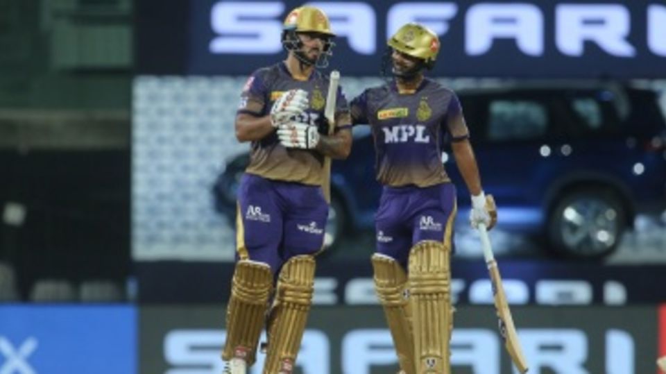 Rahul Tripathi congratulates Nitish Rana after the latter reached his fifty