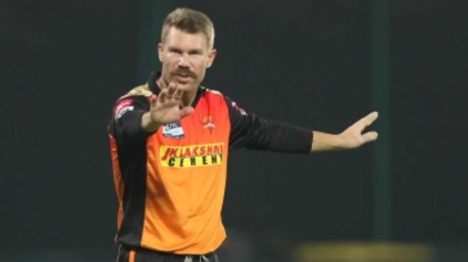David Warner sets his field