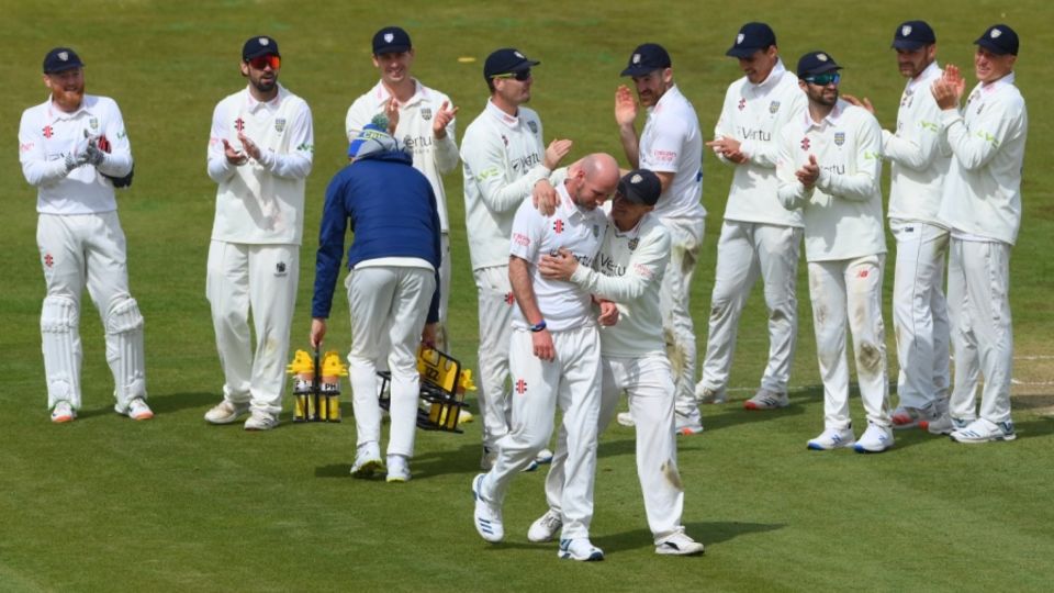 Chris Rushworth takes the applause of his team-mates after becoming Durham's all-time leading wicket-taker