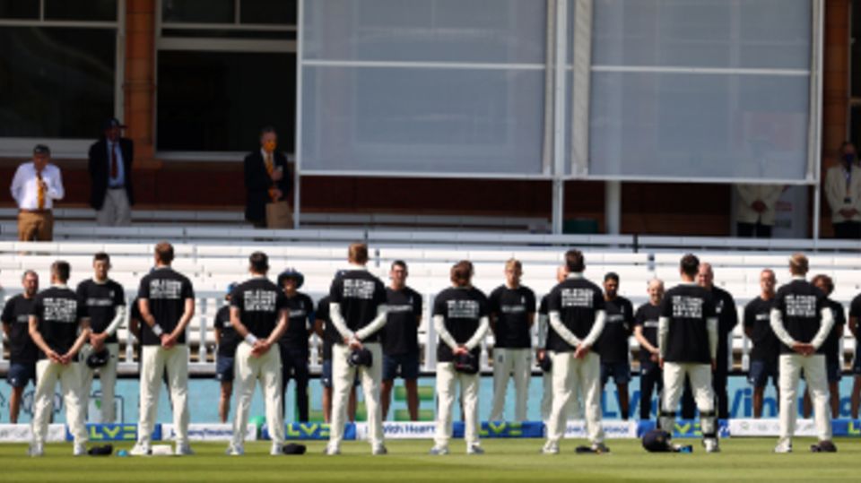 England players and staff stand for a Moment of Unity whilst wearing anti-discrimination T-shirts