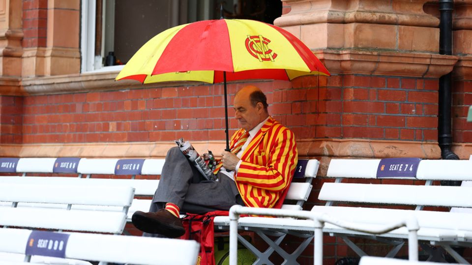 An MCC member takes an early lunch as the rain falls